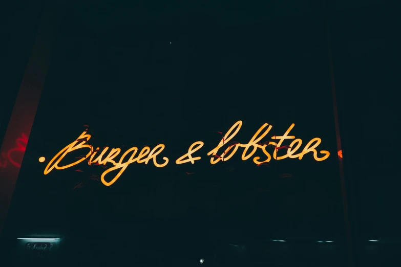 a large neon sign with the word burger e loftstar on it