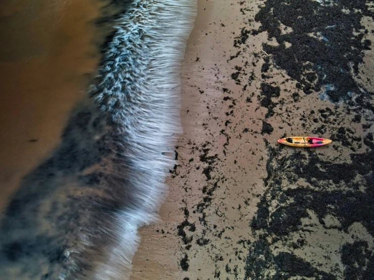 an aerial s of a surfer riding the waves