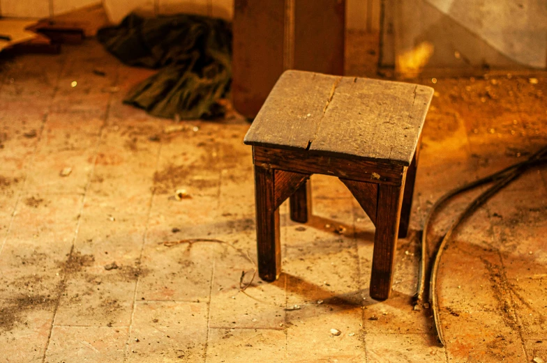 an old table sits alone in a mess