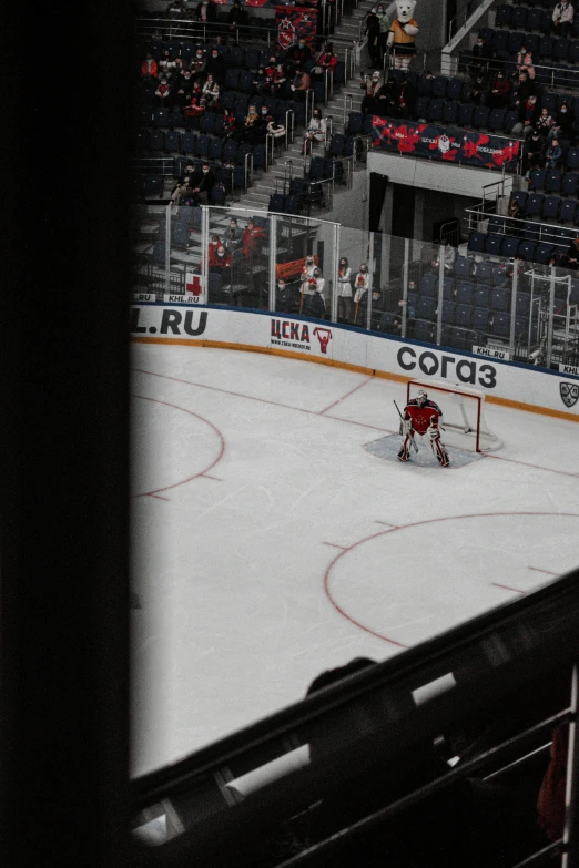 an ice hockey arena with fans watching a game