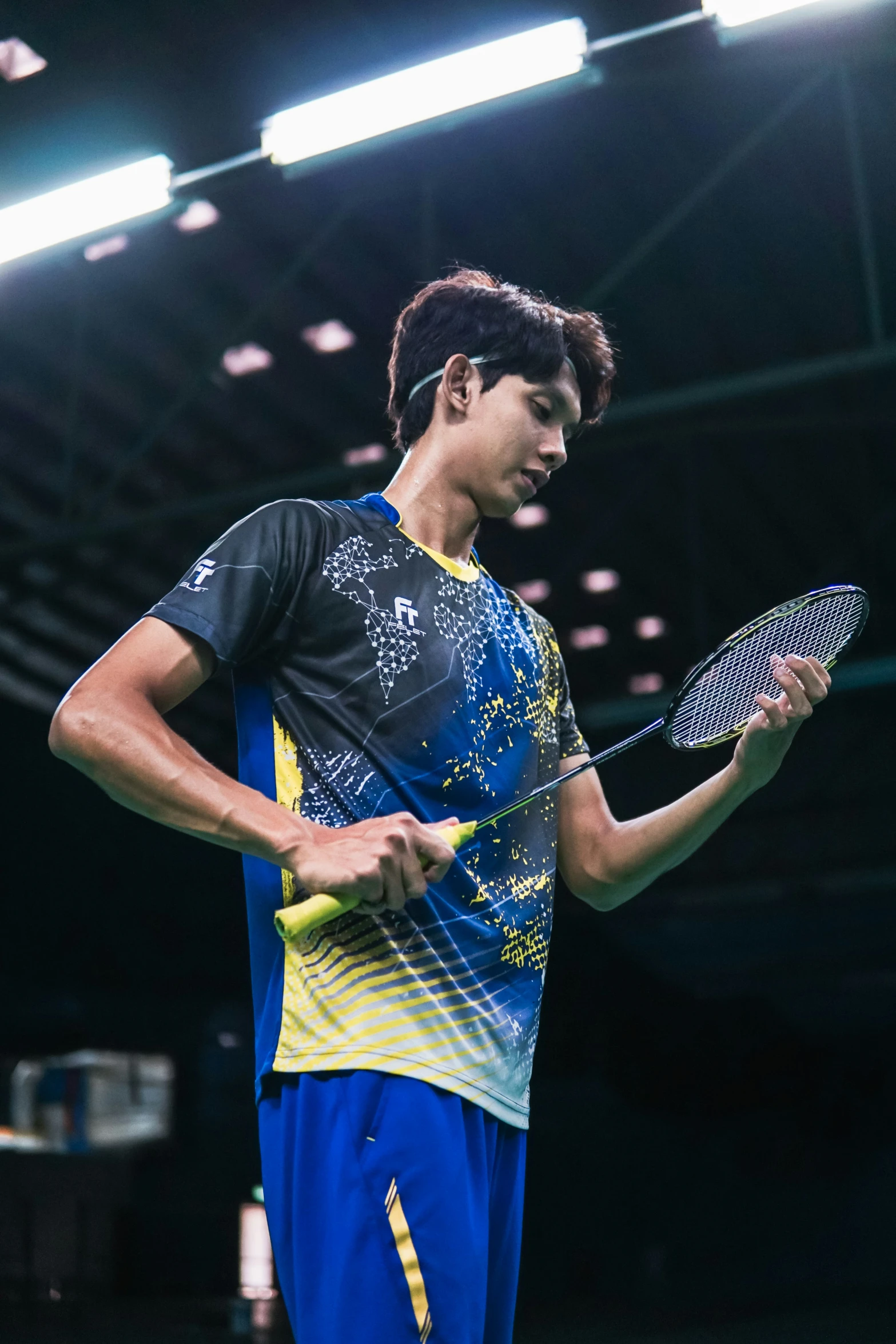 an athlete standing on top of a tennis court holding a racquet