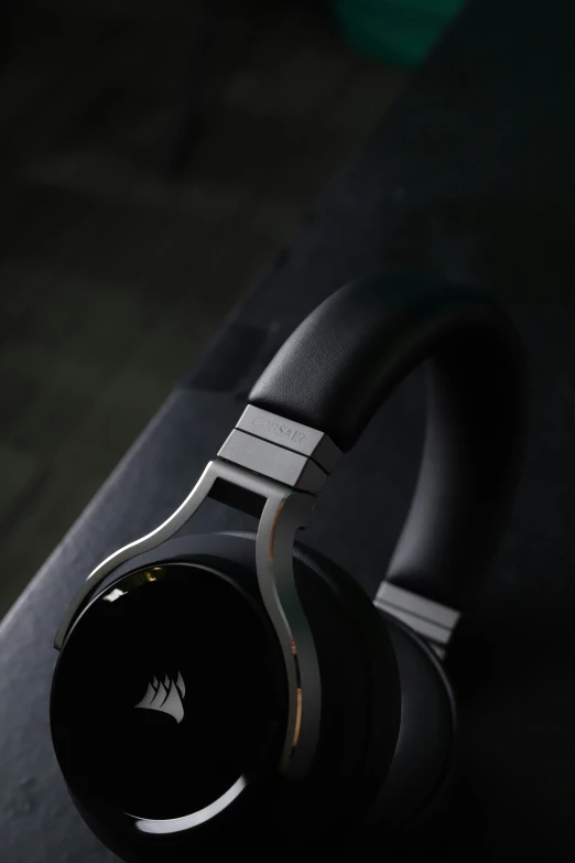 an image of a pair of headphones resting on a black surface