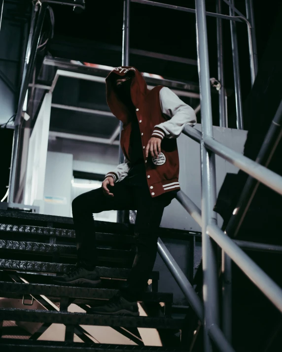 a man sitting on top of some steps