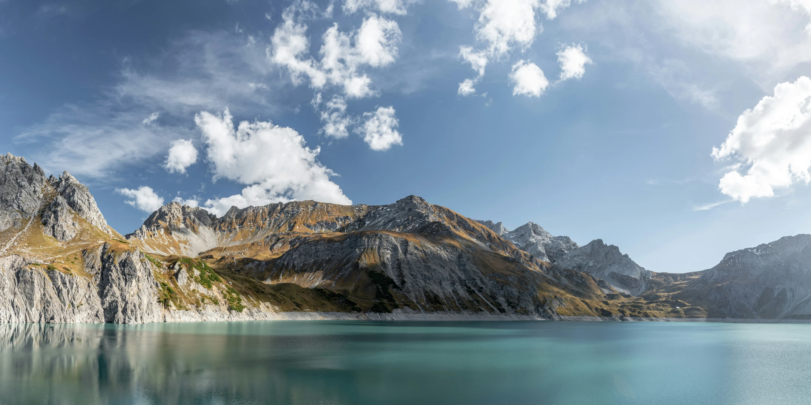 the mountains are majestic with blue water