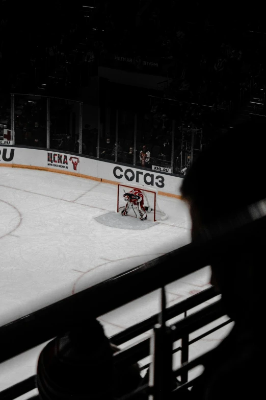 hockey goal, with net in background on ice rink