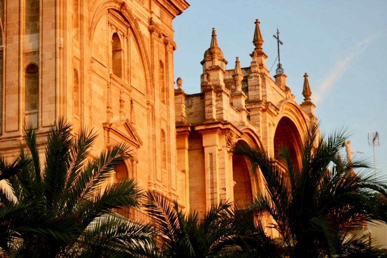 large ornate building with many spires and a clock