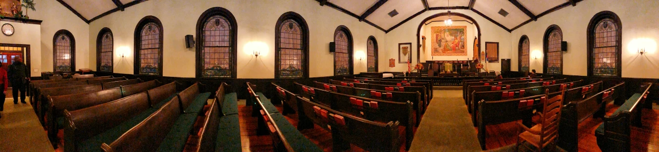 a row of empty pews in a church