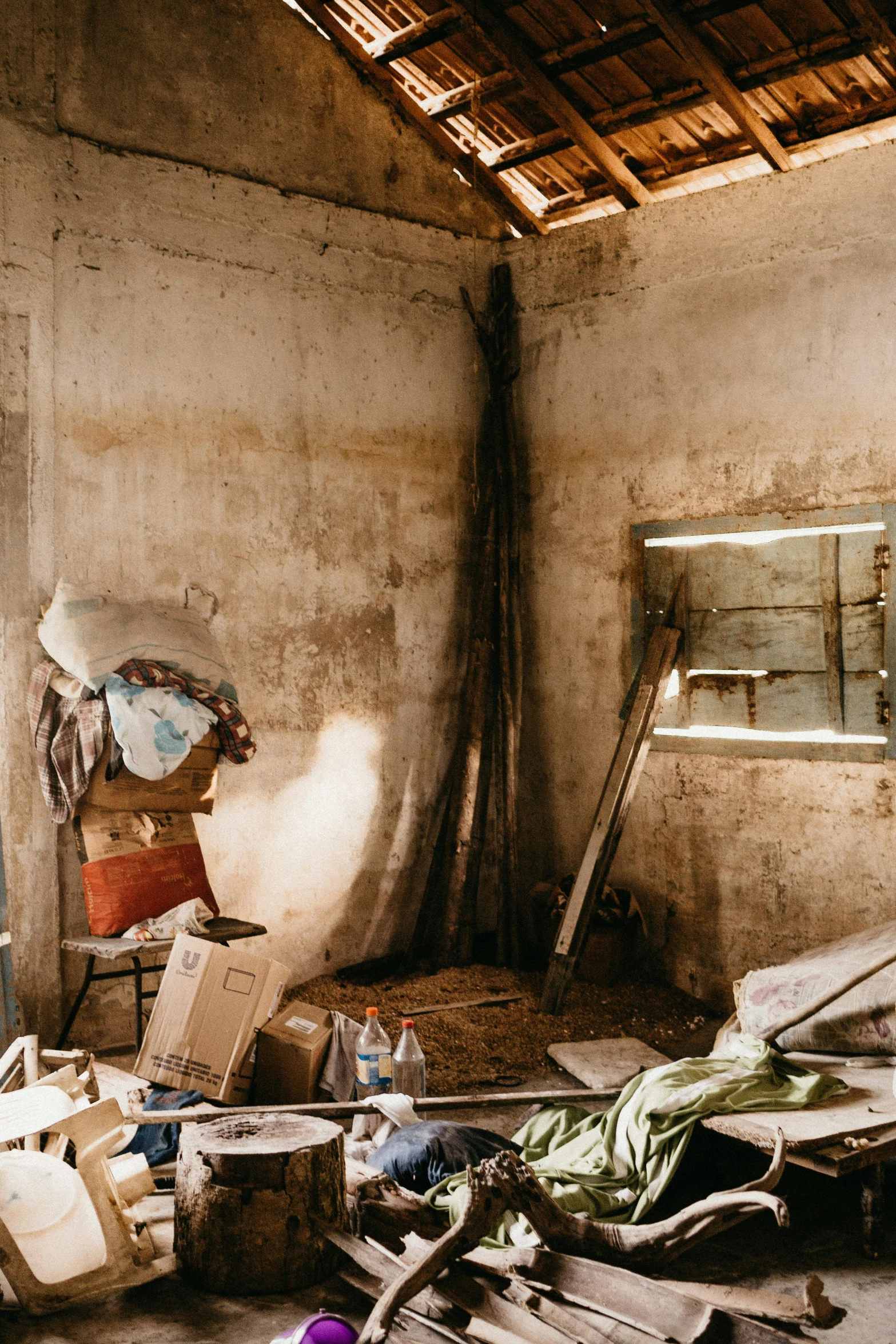 debris everywhere in a dirty room under the roof