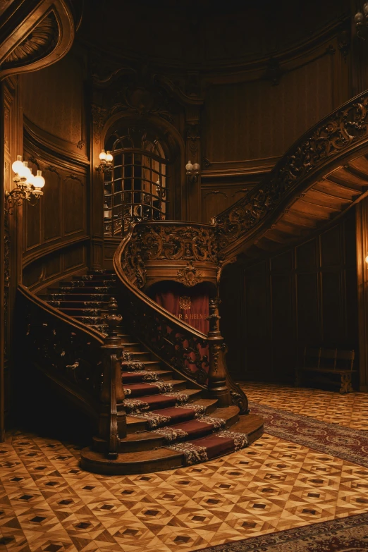 a staircase in an ornate building with marble floors