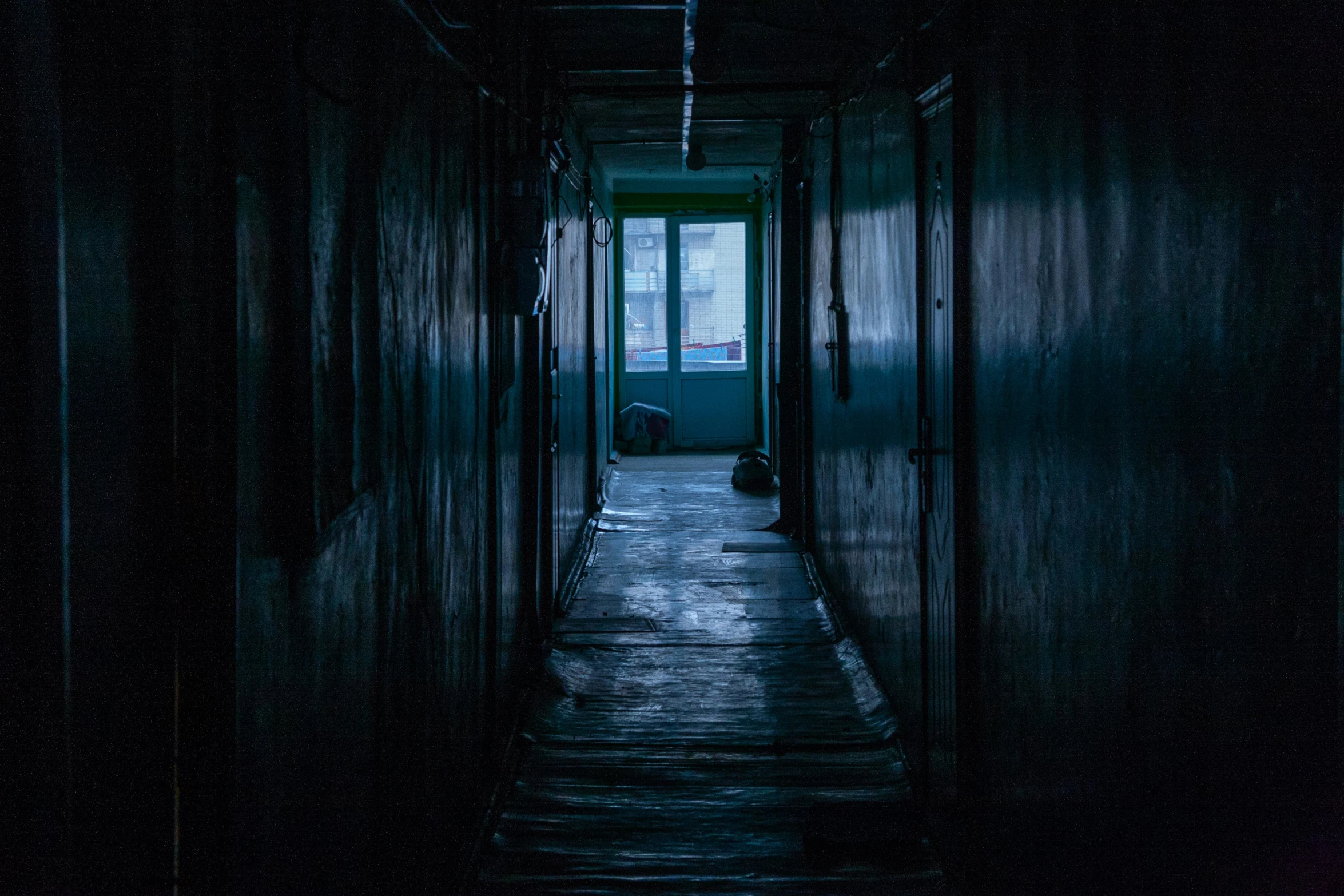 a hallway inside of an old abandoned building