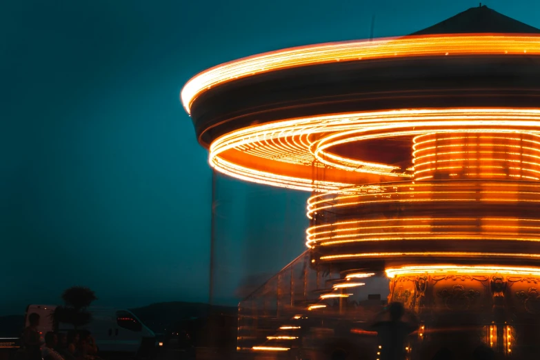 the carousel at night with a blurry background