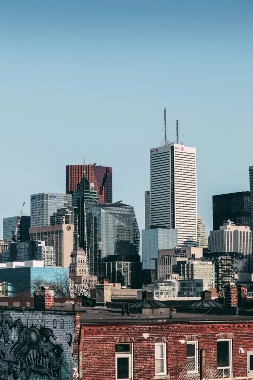 a view of the city from top of a brick building