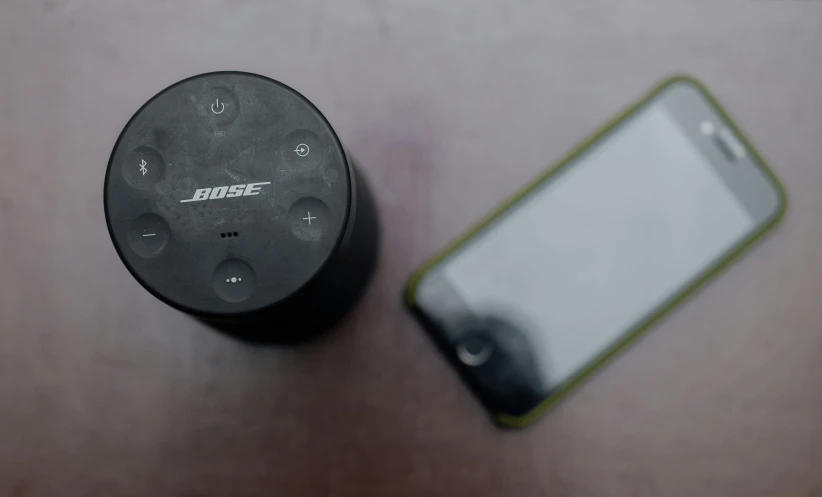 cellphone next to an echobox sitting on a table