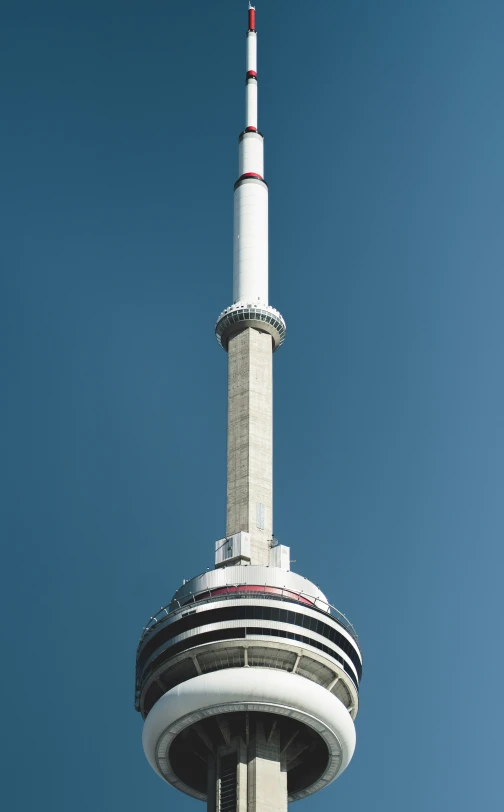 an upward view of a tall building that looks like the tower of an empire