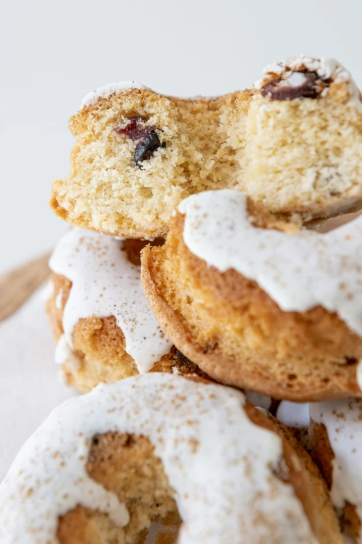 sugar covered crumbs on baked donuts with icing