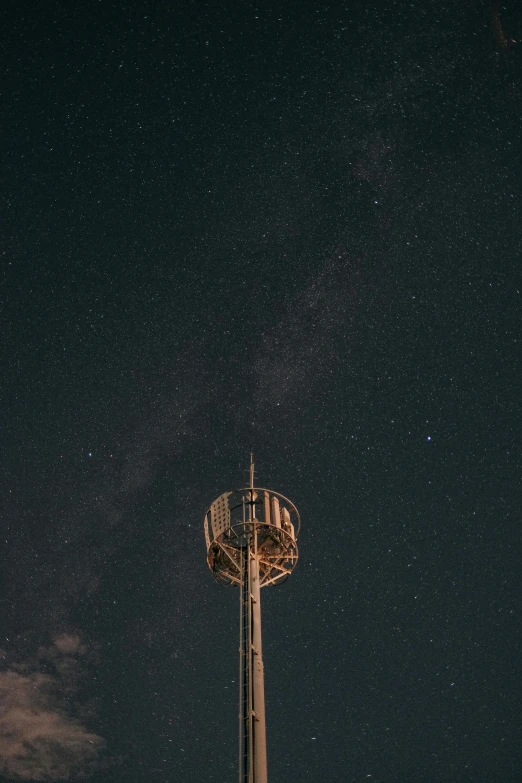 the tower is next to the building at night