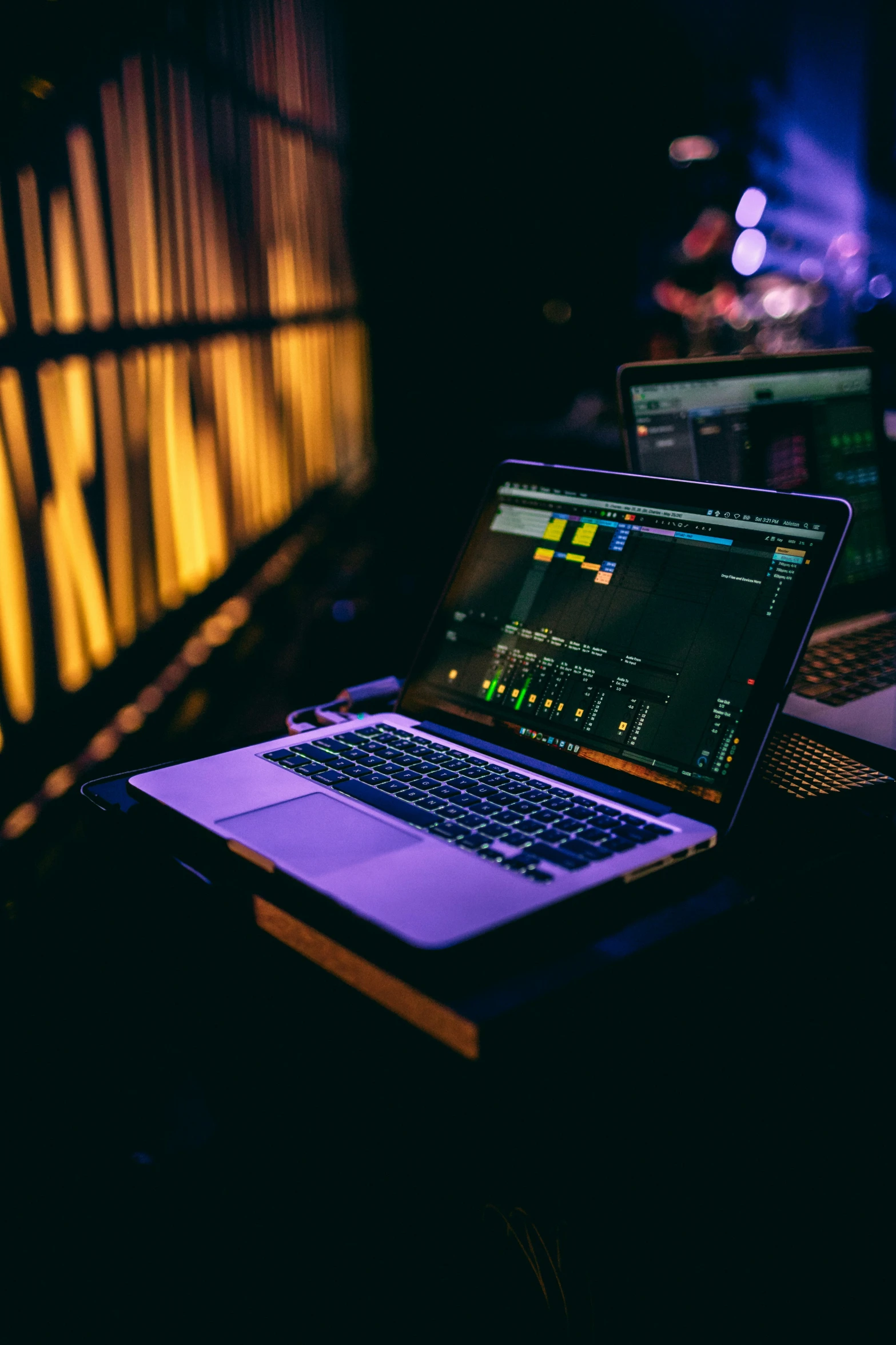 an open laptop computer sitting on top of a table