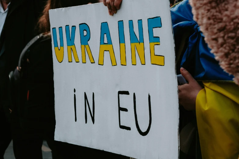 a protest is held by a group of people holding signs