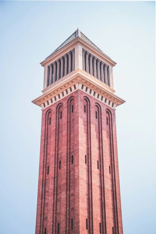 a tall clock tower in front of a blue sky