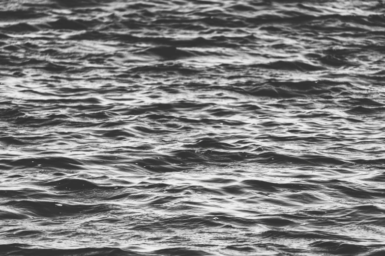 a person riding a surfboard on the ocean waves