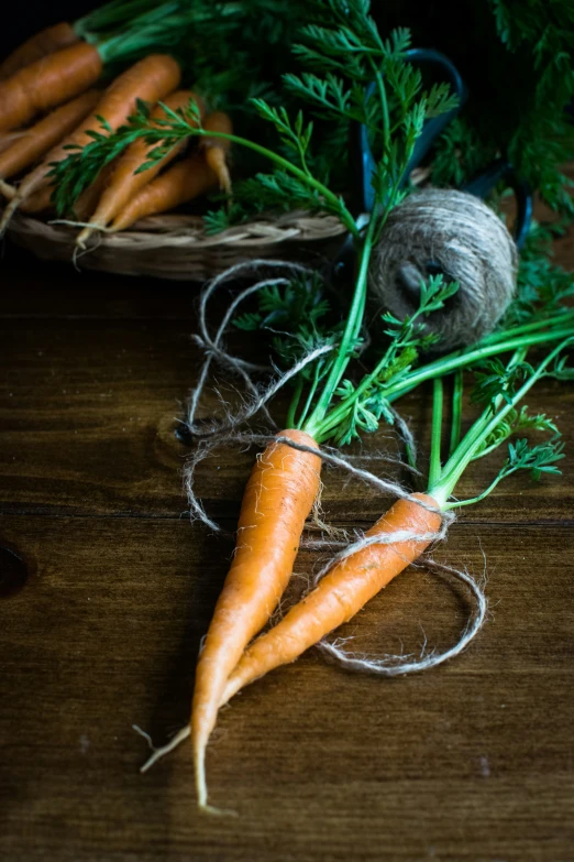 carrots are being picked from a basket