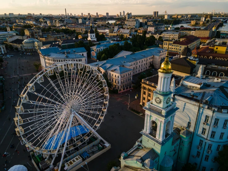 a ferris wheel in front of a city