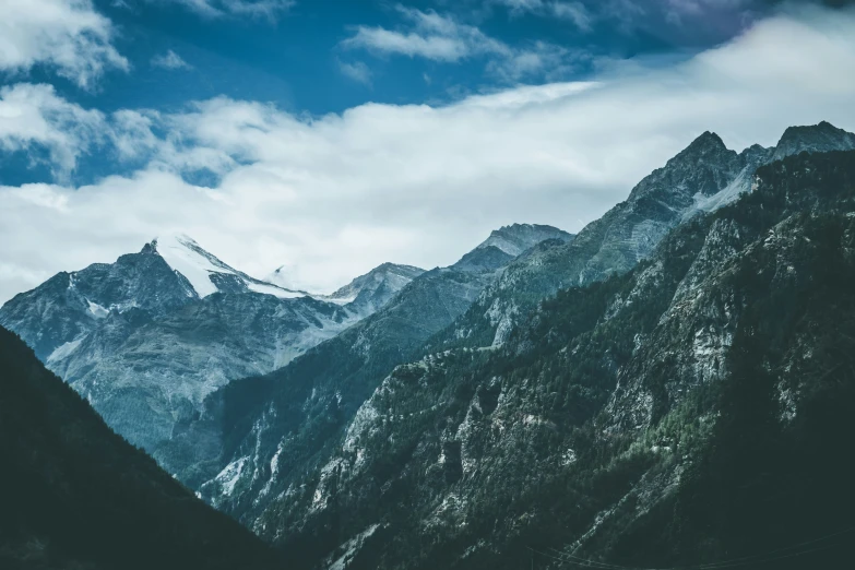 a po of some mountains under clouds