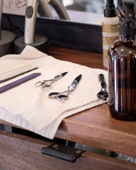 a table with silverware on top of a napkin