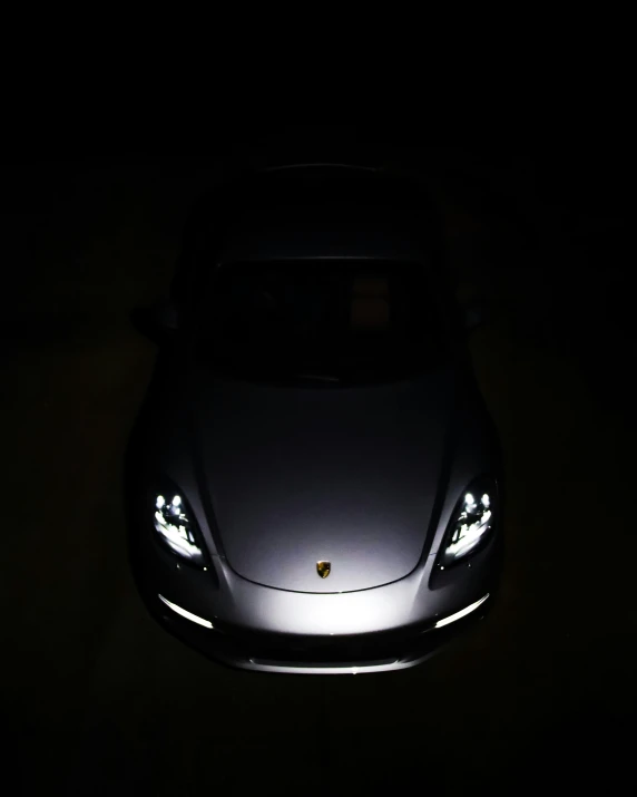 a car that is sitting in the dark