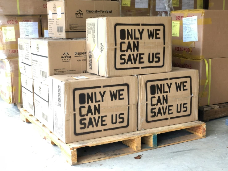 a set of three boxes on pallets with a save us sticker on each