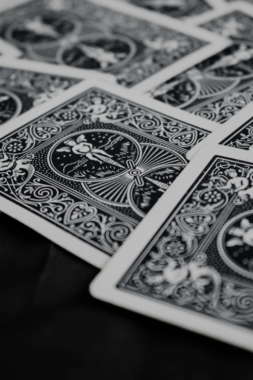 three dimensional black and white pictures of playing cards