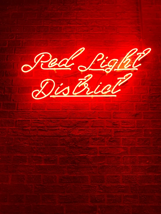 a brick wall that says red light district