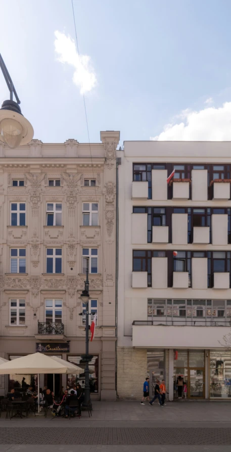 a white building with many windows on a sunny day