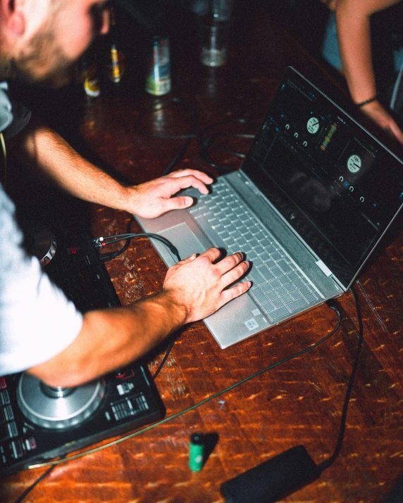 an open laptop computer sitting on top of a table