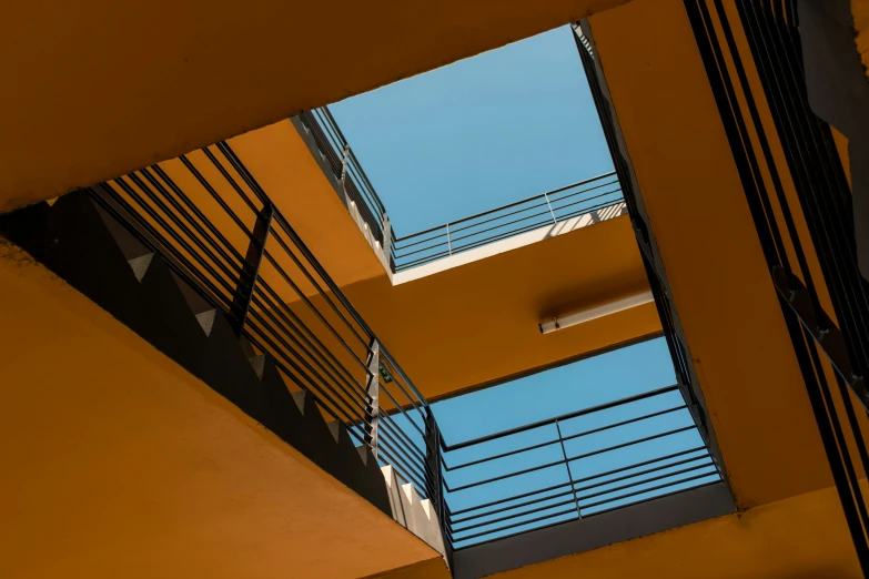 two buildings have different shapes and sizes with railings