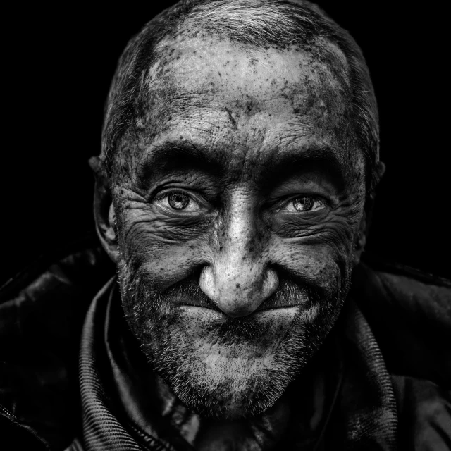 black and white portrait of a man with wrinkles on his face