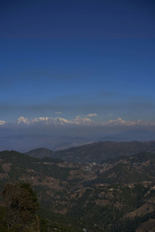 view of the mountains and land from a hilltop