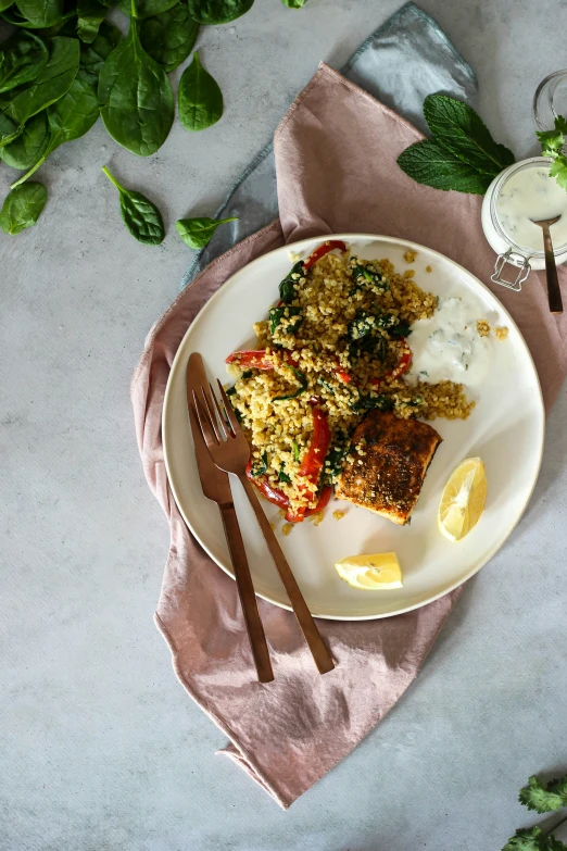 a meal is served on a plate with forks