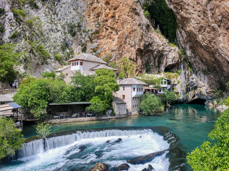 a building and some waterfall in the background