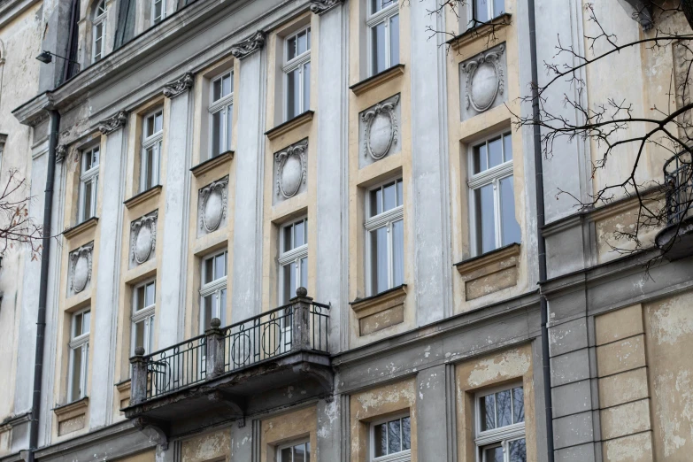 a very tall building with windows and balcony