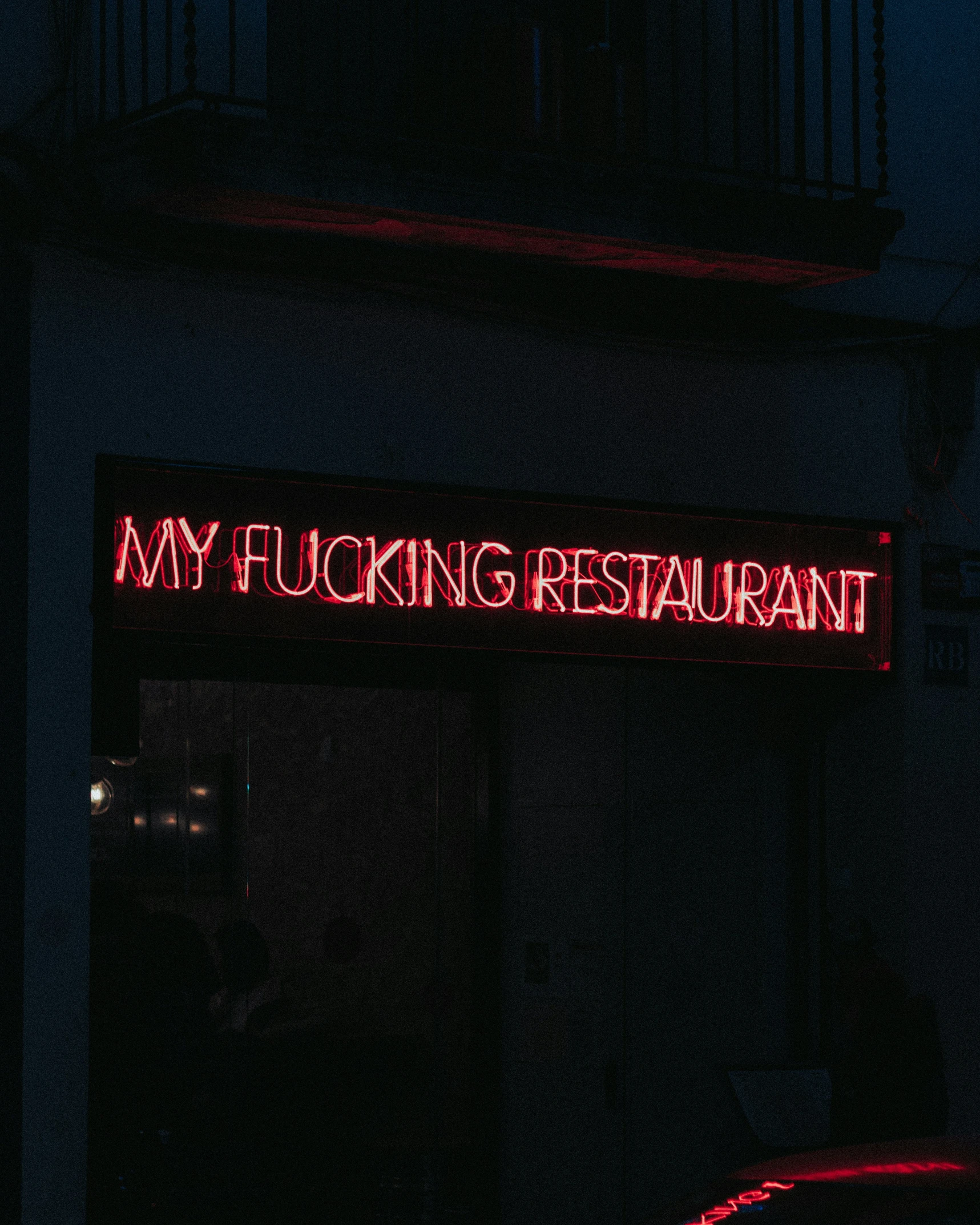 a restaurant entrance with the words my ing restaurant written on it