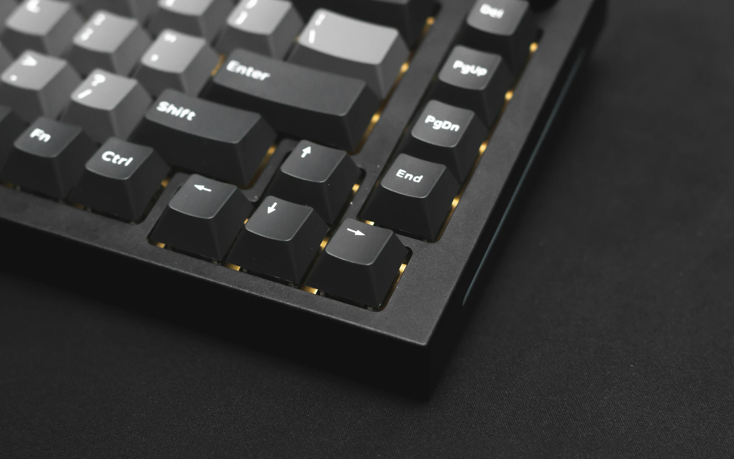 a close up s of a keyboard on a black surface