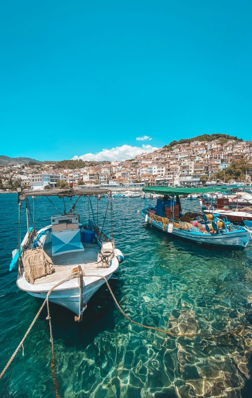 some boats floating on top of the water