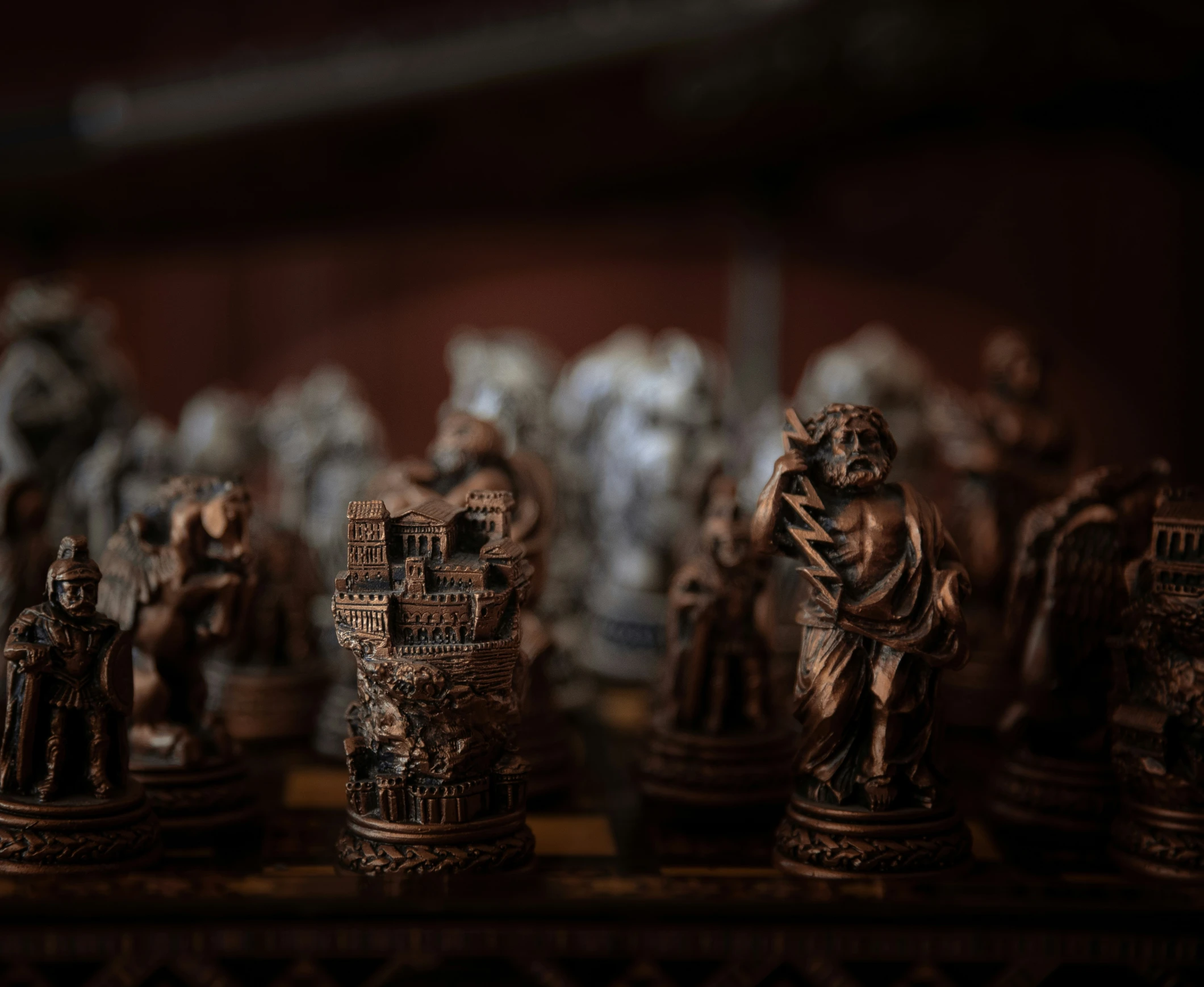 a table holding all pieces of figurines with brown colors