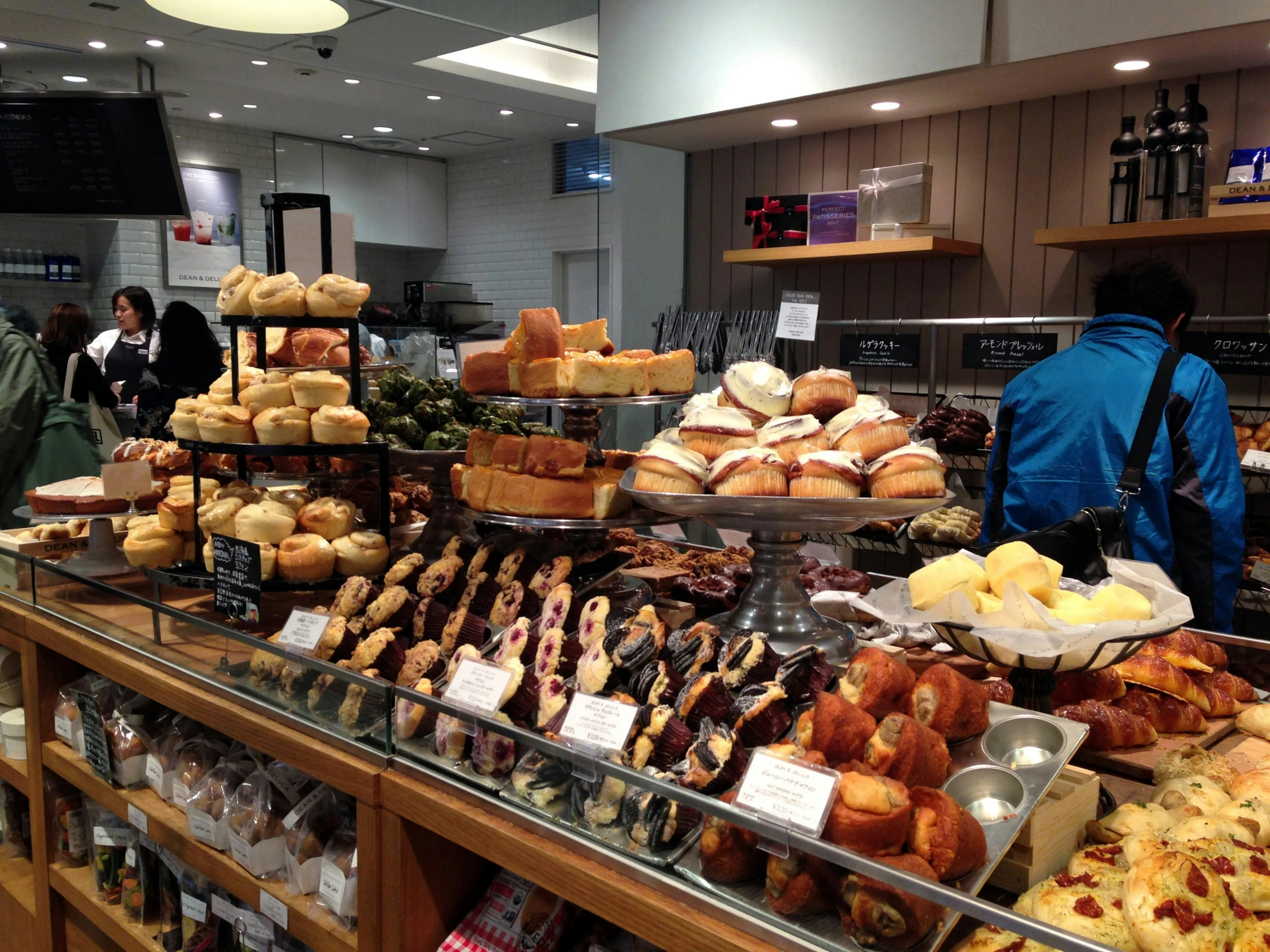 there are many different pastry on the display counter