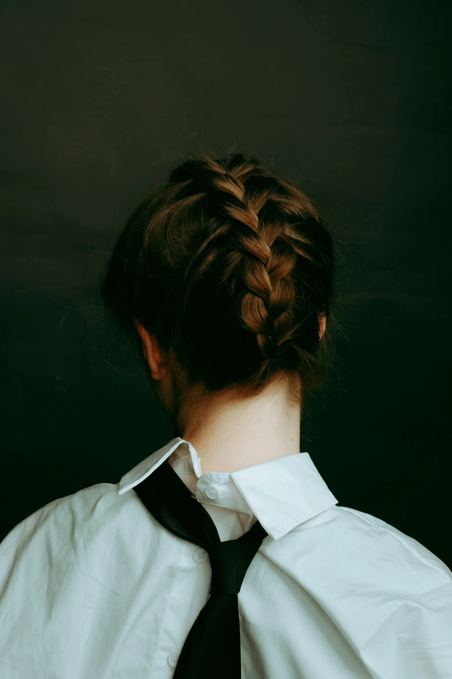 a person with a tie on the neck