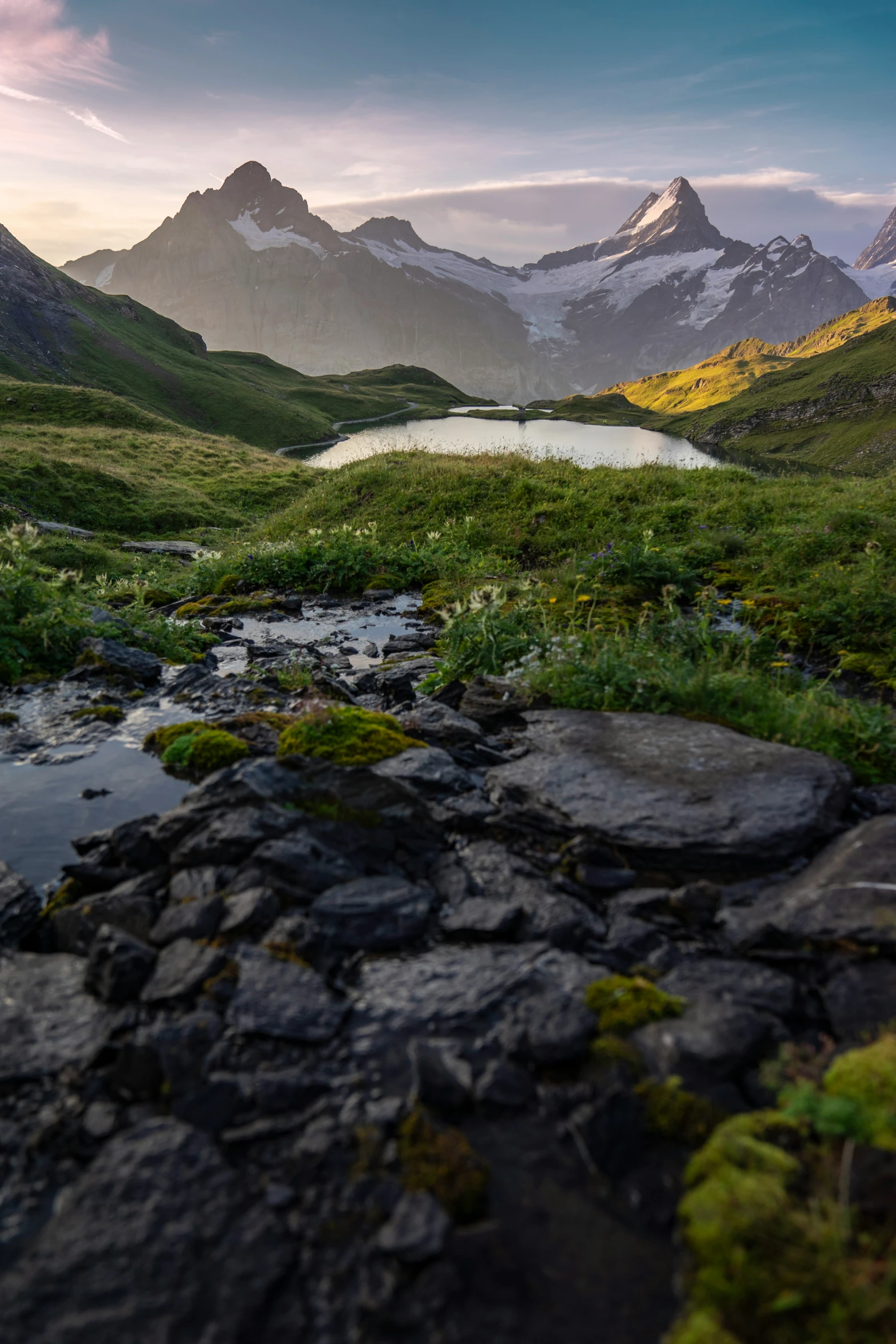 a valley with lots of rocks on the side and some water in the middle