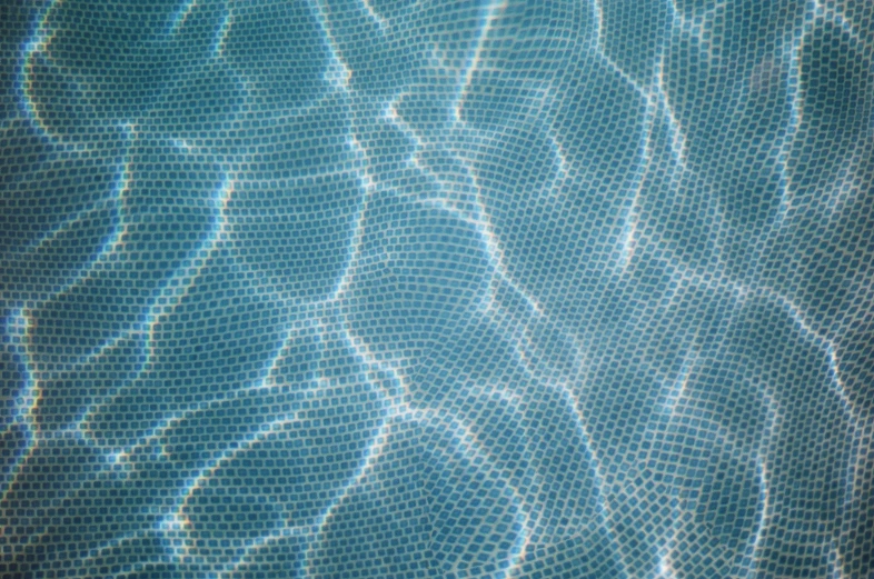 closeup of an abstract blue pattern in a pool
