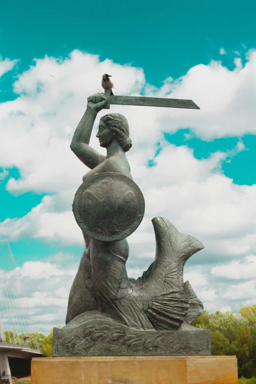 the statue of a woman holding a knife in her hand