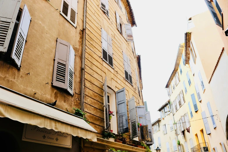 there is a corner of a building with a awning on the front